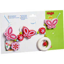 Laden Sie das Bild in den Galerie-Viewer, Haba - Holz Kinderwagenkette Schmetterling mit Glöckchen